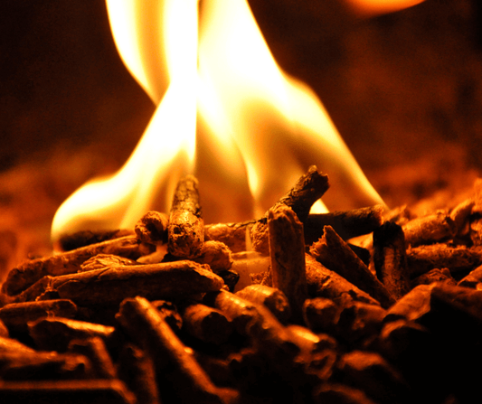 Close up of pellets lit with a flame