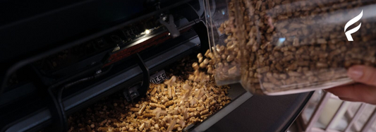 An image of a person filling a pellet insert with pellets
