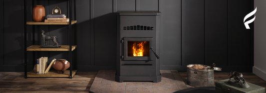 Black stove lit in a darkened room