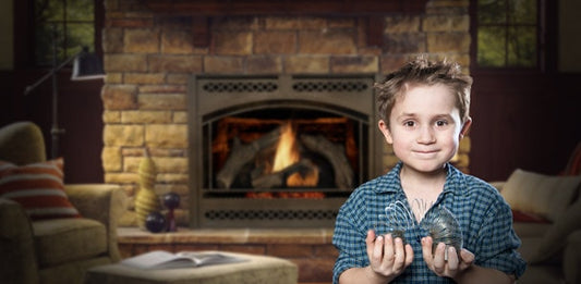 A child playing with a slinky in front of a home fireplace