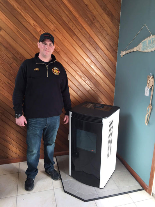 A fireman stands next to his new stove