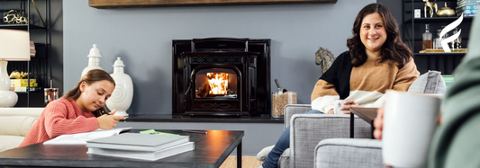 A family enjoying their Harman Accentra fireplace insert inside a home
