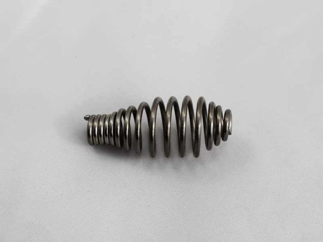 Metal spring handle on a light gray background